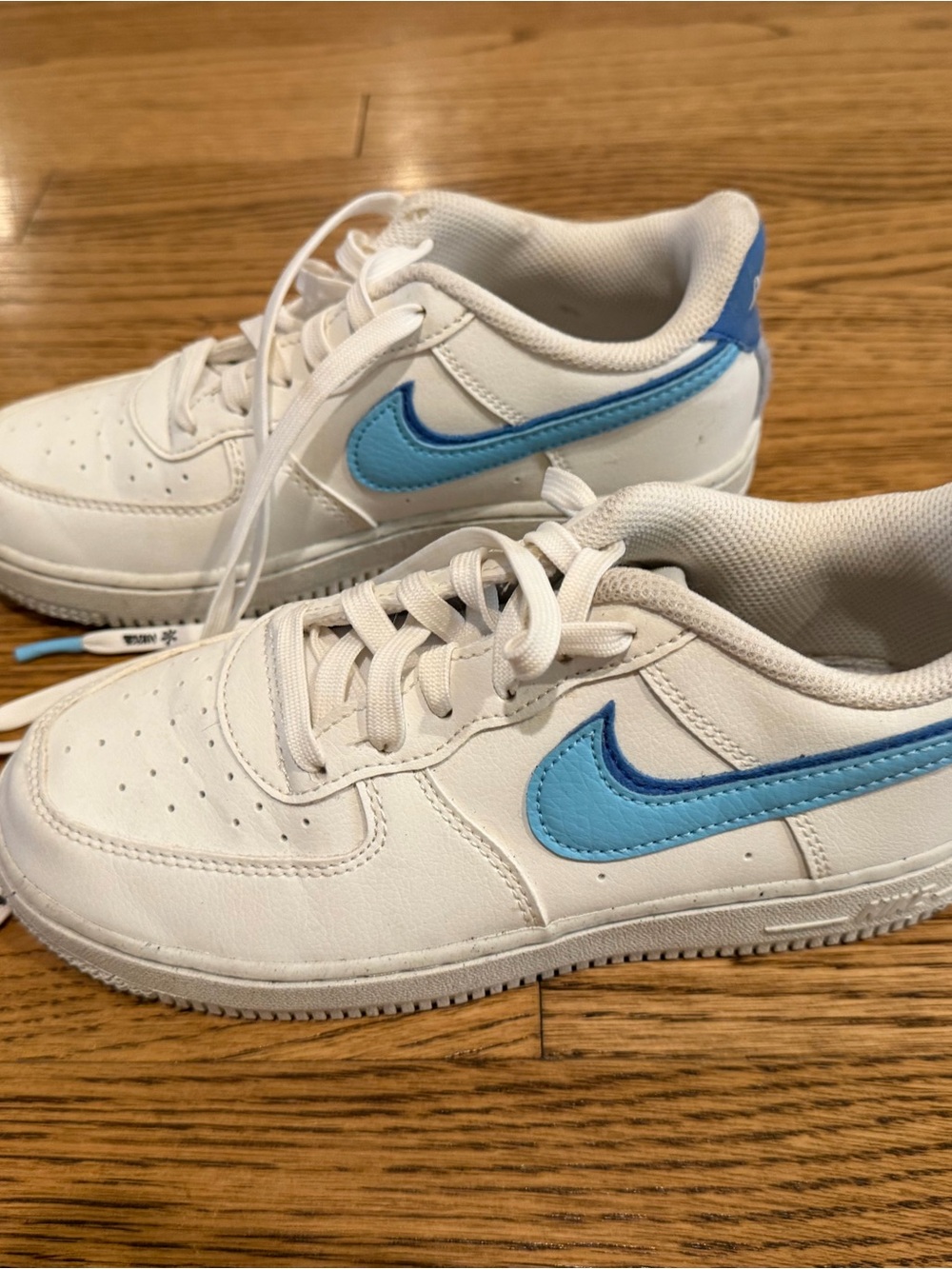Nike Kids White Sneakers with Light Blue Swoosh